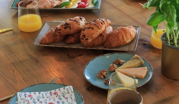 Breakfast with fresh ingredients on the wooden dining table of the luxury villa Krk Baska II on the island of Krk