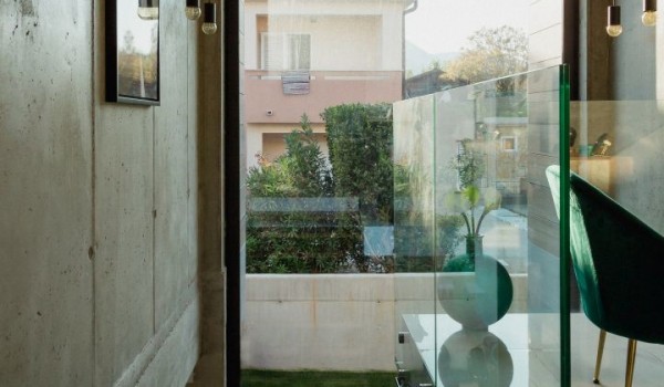 Wooden internal stairs with a view of the courtyard and leading to the first floor of the luxury villa Krk Baska II on the island of Krk