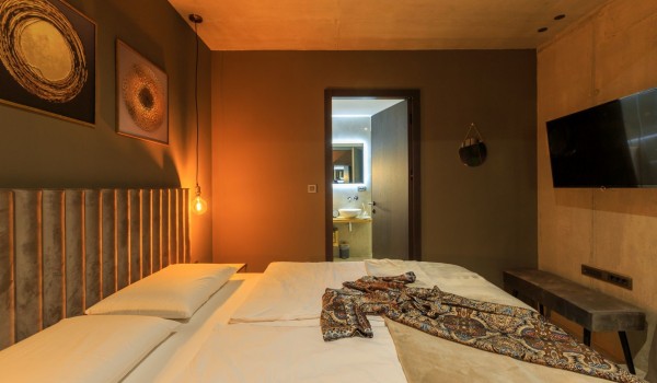 Bedroom in luxury villa Krk Baska II with double bed, LCD TV and en suite bathroom.