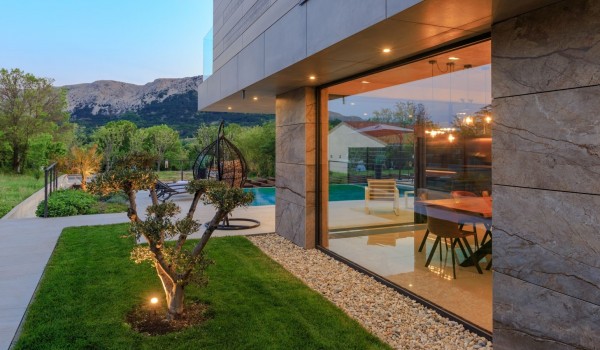 The grounds of the luxury villa Krk Baska II on the island of Krk decorated with greenery and trees