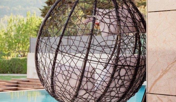 Garden swing on the outdoor terrace of the luxury villa Krk Baska II in Baška on the island of Krk