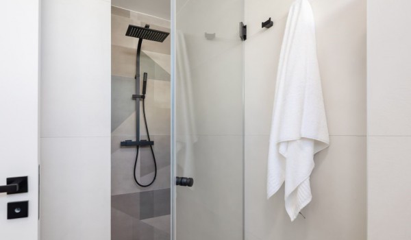En suite bathroom with a modern walk in shower