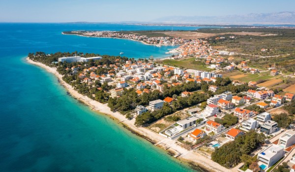 Aerial view on the property of Villa Idria with the neighbourhood and coastal area