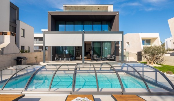 Front of Luxury Villa Idria Sea and View with private heated hydro massage pool, patio with loungers and terrace