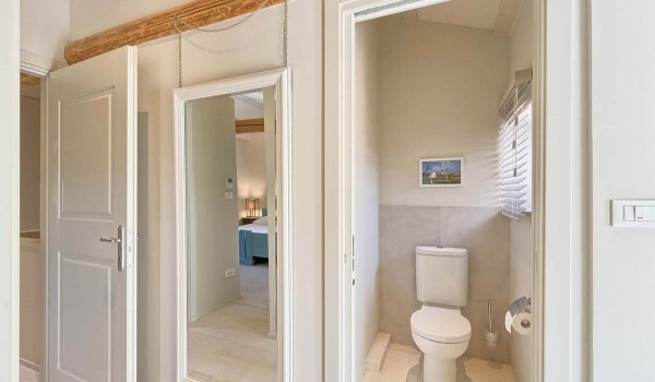 Entrance to the separate toilet inside the family villa Deluxe Manor Baderna for vacation in Istria