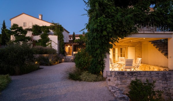 Spacious landscaped yard of the luxury villa with pool Deluxe Manor Baderna with various Mediterranean plants