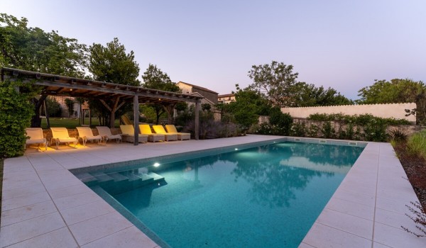 Private pool on the terrace surrounded by greenery from the landscaped garden of the Deluxe Manor Baderna villa for rent in Radovani