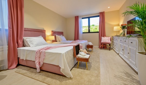 Comfortable double size beds in an air-conditioned modern bedroom with SAT TV  in luxury  villa Raquel  with concierge service and private parking on the island of Šolta