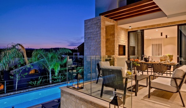 View from the terrace of the lounge area for living and the large swimming pool of the luxury villa for rent Raquel on the island of Šolta in the town of Nečujam