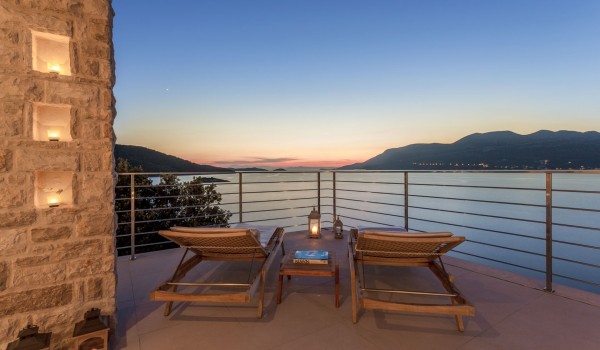 Deck chairs on the terrace of a luxury family villa at the beach on Korcula island