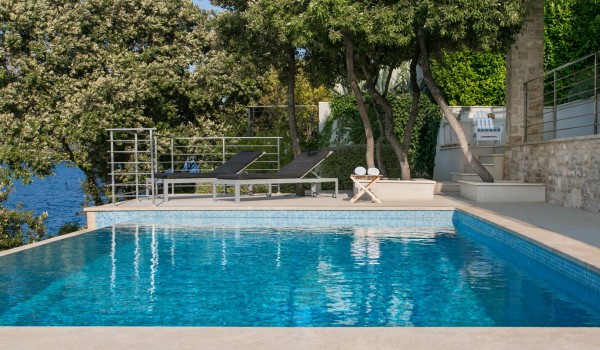 Sun loungers by the private pool of a luxury Croatian villa with private parking and wifi