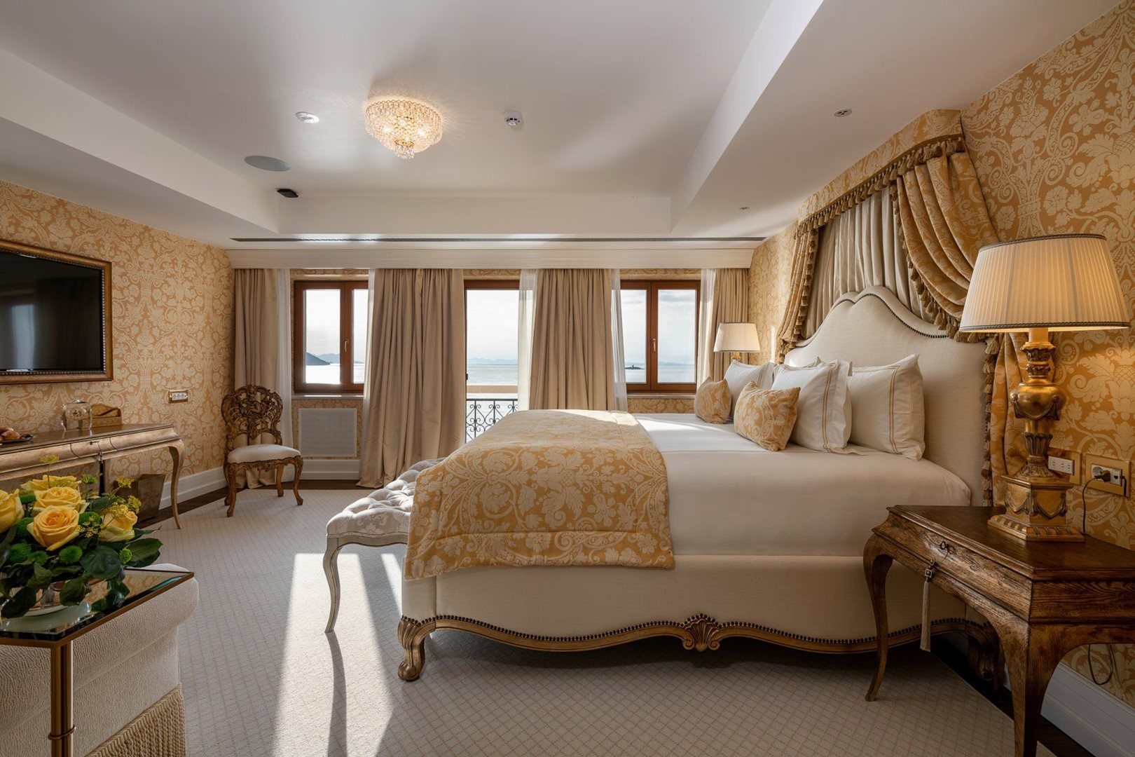 King size bed in a bedroom of a luxury family suite Korta Katarina 302 for vacation on Peljesac island