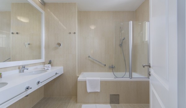 En suite air -conditioning bathroom with bathtub and shower in luxury family villa in Istria with pool. sauna and jacuzzi.