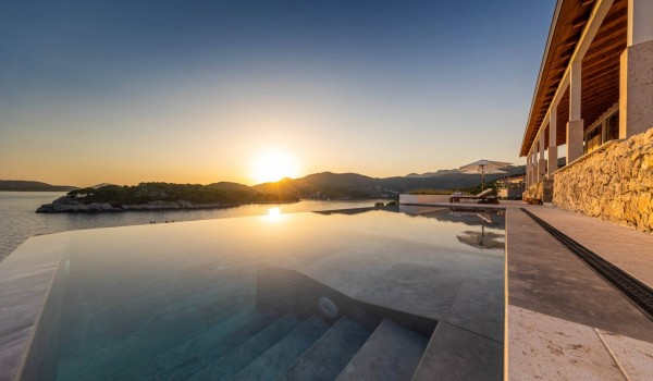 Infinity pool by the sea in Dubrovnik luxury rental villa for romantic vacation.
