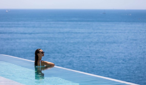 Infinity pool by the sea in  luxury romantic villa Crystal Palace in Dubrovnik with infinity pool for vacation and rent.