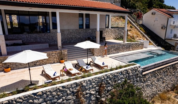 Sunbathing area neaar pool in Dubrovnik luxury family villa by the sea.