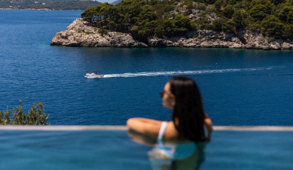 Infinity pool by the sea in  luxury romantic villa Crystal Palace in Dubrovnik with infinity pool for vacation and rent.