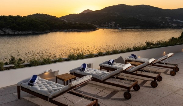 Cozy deck chairs with beautiful view in Croatian luxury villa Crystal Palace in Dubrovnik for vacation and rent.