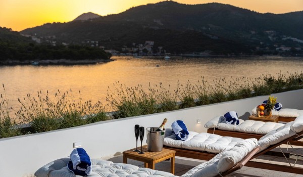 Cozy deck chairs with beautiful view in Croatian luxury villa Crystal Palace in Dubrovnik for vacation and rent.