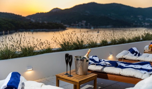 Cozy deck chairs with beautiful view in Croatian luxury villa Crystal Palace in Dubrovnik for vacation and rent.