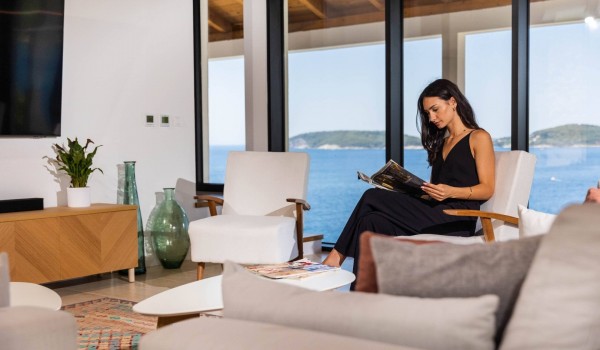 Comfortable sofa in the living room of luxury Croatian villa Crystal Palace for romantic vacation with pool.