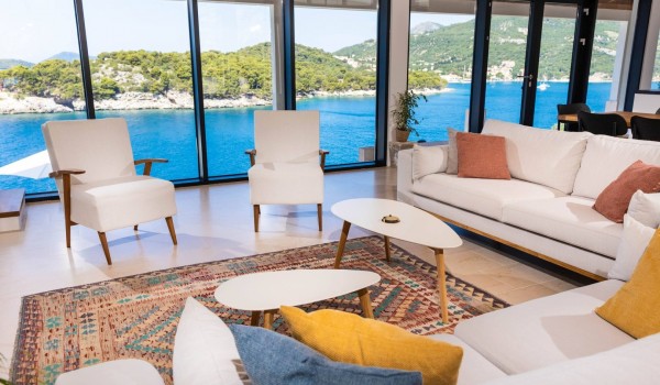 Armchairs and sofas in beachfron Croatian luxury villa Crystal Palace in Dubrovnik for family vacation and rent.