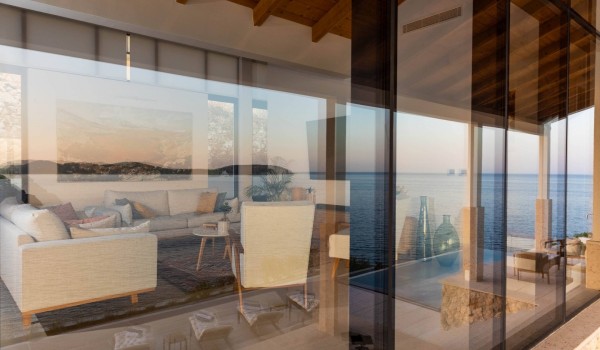 Glass wall in luxury Croatian villa Crystal Palace Dubrovnik for romantic vacation with infinity pool.