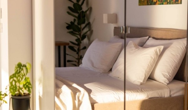 Airy bedroom with bed linen in Dubrovnik luxury vacation villa Crystal Palace by the sea.