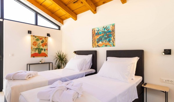 Airy bedroom with bed linen in Dubrovnik luxury vacation villa Crystal Palace by the sea.