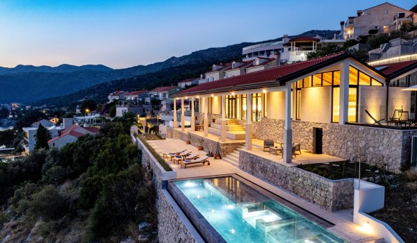 Night picture of luxury Croatian villa Crystal Palace in Dubrovnik with infinity pool for romantic vacation.