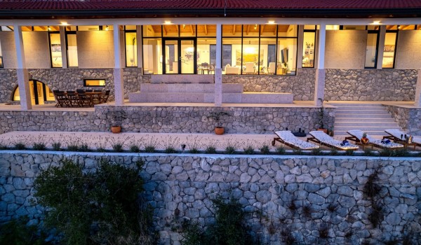 Night picture of luxury Croatian villa Crystal Palace in Dubrovnik with infinity pool for family vacation and rent.