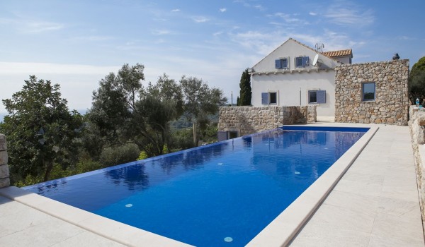 Private pool of the luxury villa Aromatica in Dubrovnik on Sipan island with the mountain view