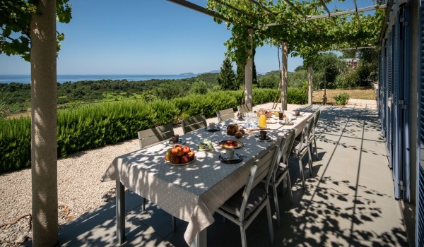 Outdoor dining table on the private terrace of the luxury holiday villa Aromatica in Dubrovnik with the sea view