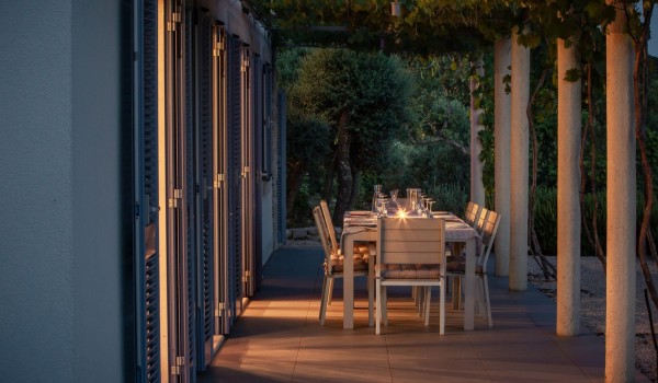 Outdoor dining table on the private terrace of the luxurious family villa Aromatica in Dubrovnik on Sipan island