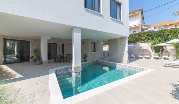 Private pool and dining table on the terrace of a Croatia luxury villa Trogir 3 for family vacation on Ciovo