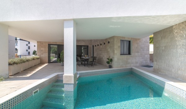 Private pool and dining table on the terrace of a Croatia luxury villa Trogir 3 for family vacation on Ciovo