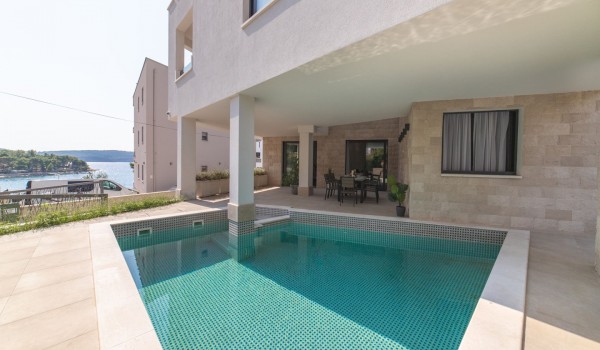 Private pool and dining table on the terrace of a Croatia luxury villa Trogir 3 for family vacation on Ciovo
