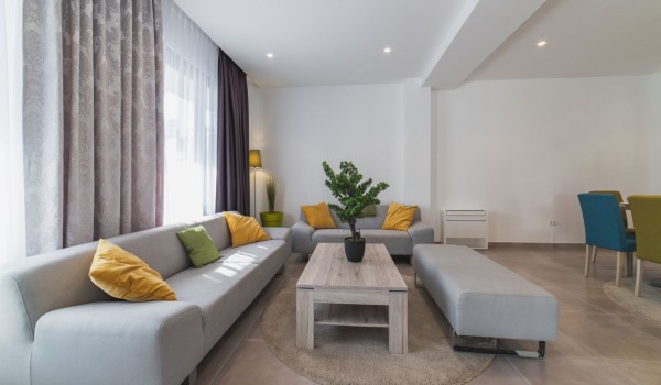 Living room with comfortable sofas and dining table in a Croatia luxury family villa Trogir 3 with private pool and sea view