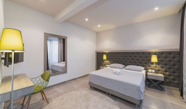 King size bed in a bedroom with en suite bathroom of a Croatia luxury vacation villa with private pool and parking