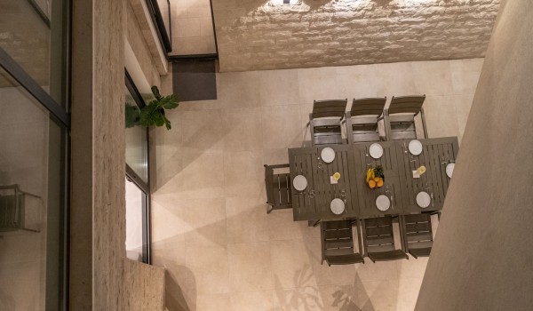 Night view of a dining table on the terrace in a Croatia luxury sea view villa with gym and sauna in Trogir