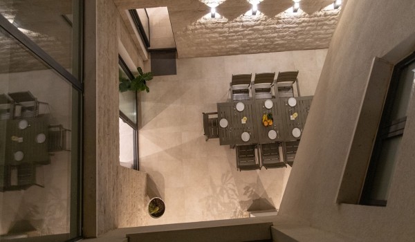 Night view of a dining table on the terrace in a Croatia luxury sea view villa with gym and sauna in Trogir