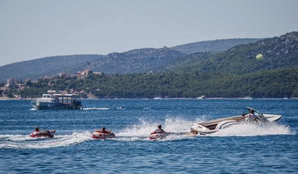 Sea activities on the beach in front of a Croatia luxury vacation villa with private pool and gym