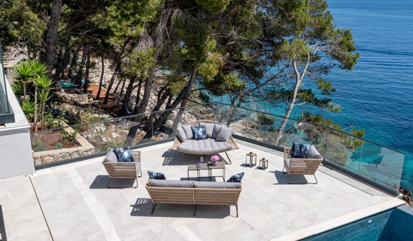 Seafront terrace with a lounge zone and a sea-view by the infinity pool in front of the luxury villa Korcula Miracul with private parking in Prizba