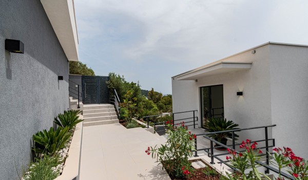 Exterior with carefully landscaped greenery and a main entrance to the exclusive romantic villa Korcula Miracul for total privacy by the sea