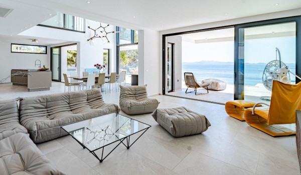 The elegant open-space airy living area with comfortable seating and access to the terrace in a luxury holiday villa on Korcula