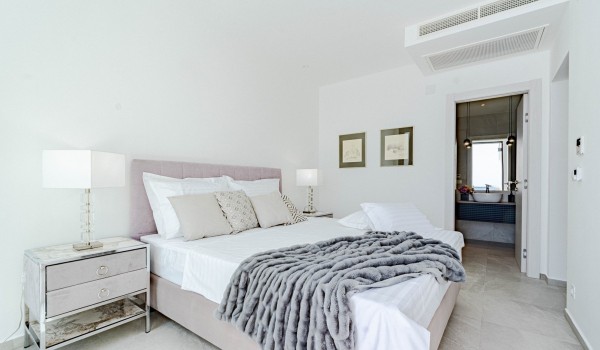Air-conditioned bedroom with a king-size bed, an en-suite bedroom and a private balcony overlooking the sea on the first floor of the luxury sea view villa on Korcula