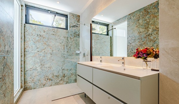 The  bathroom with a shower, vanity and toilet of a Croatia luxury seafront villa Miracul for 12 on Korcula