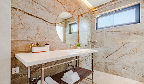 The  bathroom with a shower, vanity unit and toilet of a Croatia luxury seafront villa Miracul for 12 on Korcula