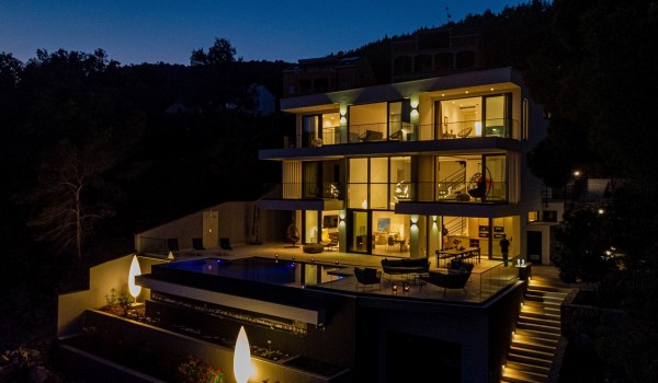 A night view of Korcula luxury holiday villa Miracul with private pool, gym, concierge service and a private beach plateau