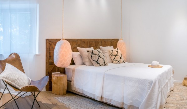 A luxurious bedroom dotted with soft shades in a luxurious holiday villa in Sumartin